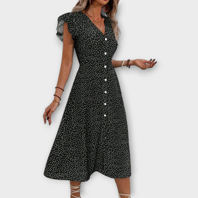 Elegante vestido midi de lunares